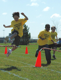 Students participate in a track and field event.